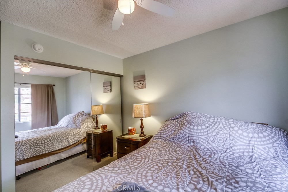 1567 Apache Drive, Unit A Chula Vista, CA 91910 - Photo 22 of 51 a bed room with a bed and a lamp