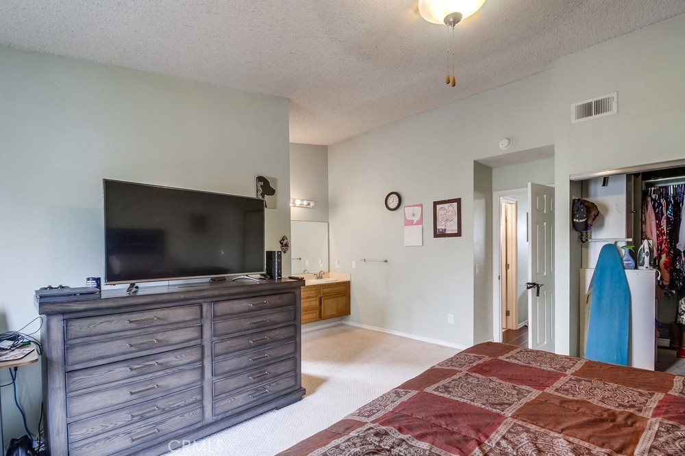 1567 Apache Drive, Unit A Chula Vista, CA 91910 - Photo 24 of 51 a bedroom with a flat screen tv and dresser