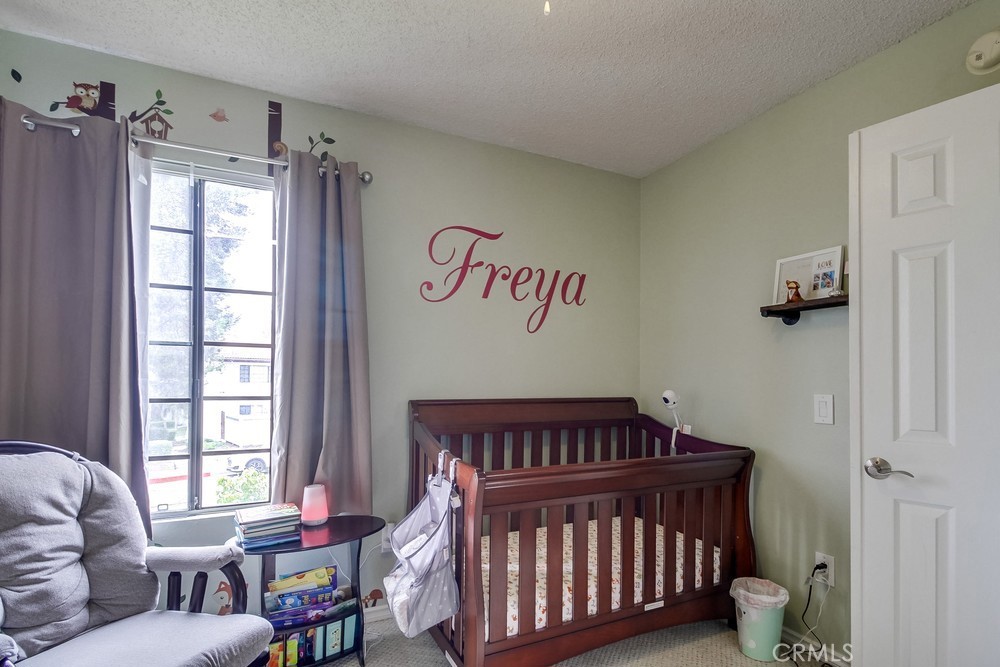 1567 Apache Drive, Unit A Chula Vista, CA 91910 - Photo 28 of 51 a bedroom with a bed and wooden floor