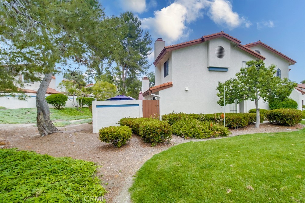 1567 Apache Drive, Unit A Chula Vista, CA 91910 - Photo 36 of 51 a front view of a house with garden