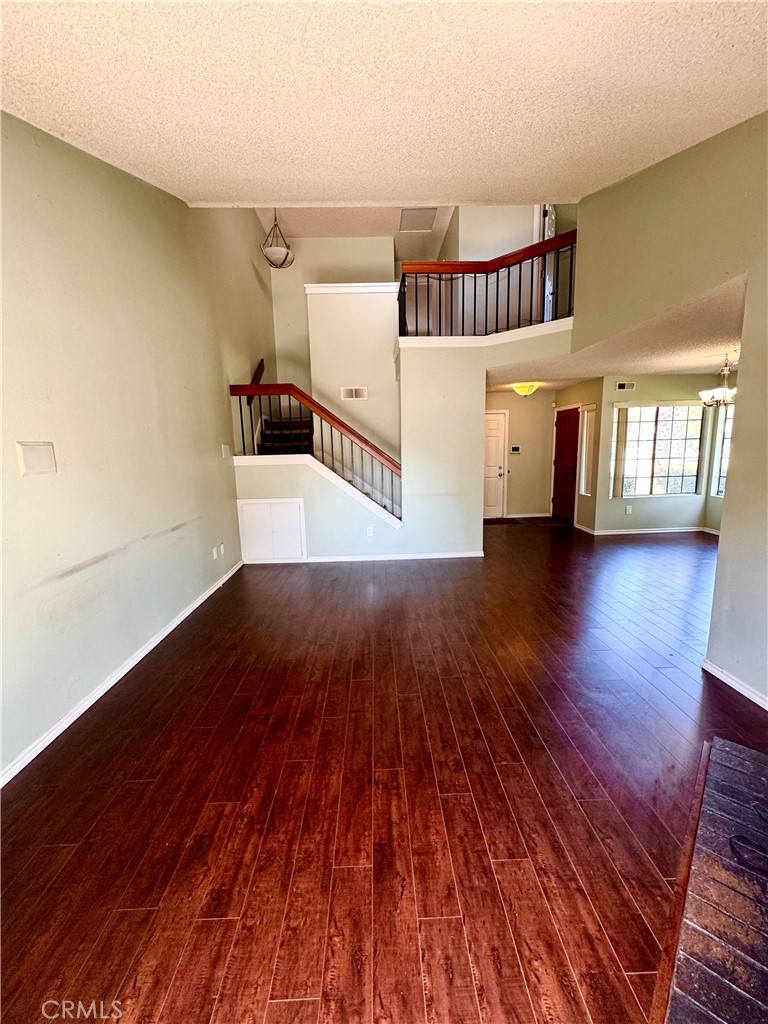 1567 Apache Drive, Unit A Chula Vista, CA 91910 - Photo 49 of 51 a view of a hallway with wooden floor