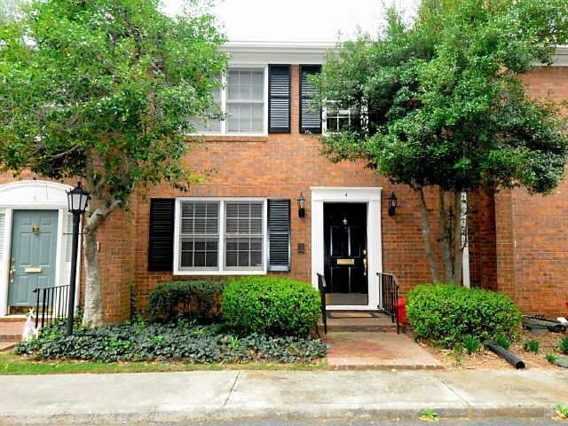 4620 Wieuca Road Northeast, Unit 4 Atlanta, GA 30342 - Photo 1 of 1 front view of a house and a yard with potted plants