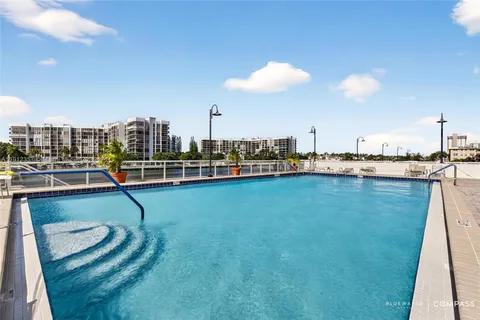 a view of a swimming pool with a lake view
