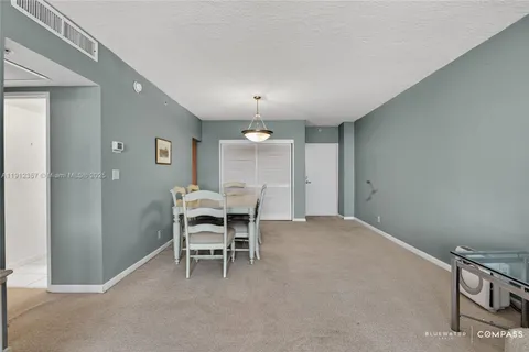 a view of a livingroom with furniture and chandelier