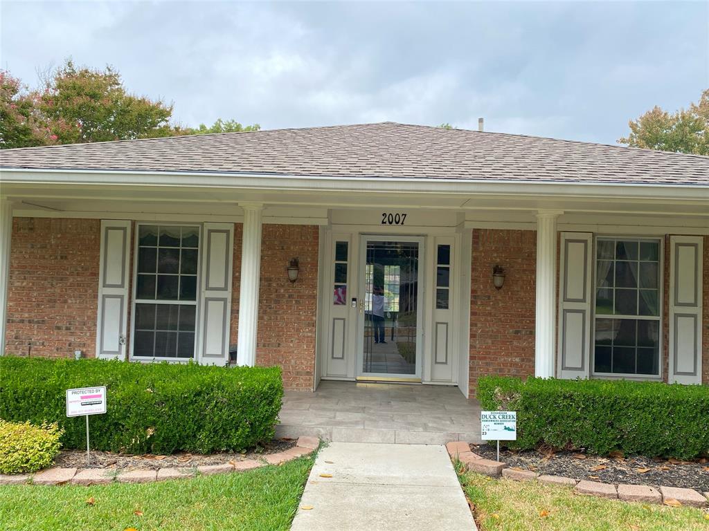 a view of a brick building with a large windows