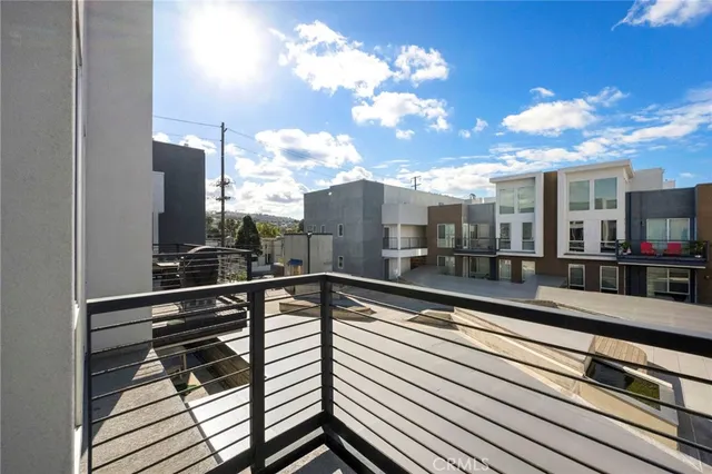 a view of a balcony with furniture