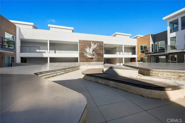 an aerial view of residential building and ocean view