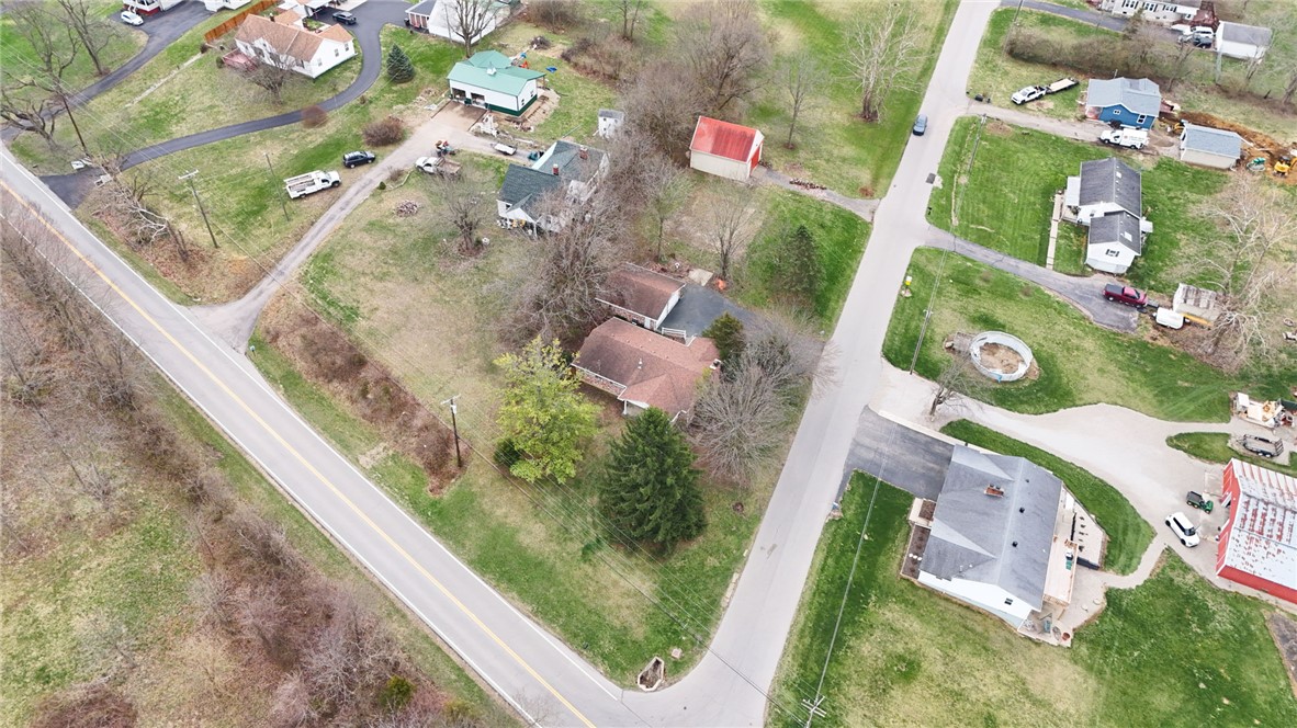 6711 Hamilton-Middletown Road Franklin, OH 45005 - Photo 40 of 49 An aerial view showcases a vibrant community with charming homes nestled amidst lush greenery and winding roads.