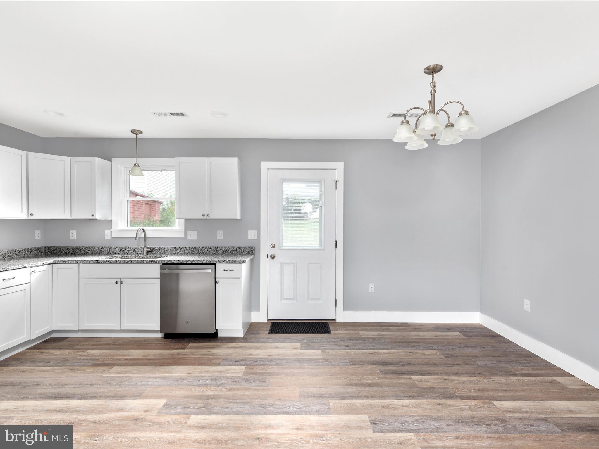 178 Bank Street Mount Jackson, VA 22842 - Photo 12 of 22 a view of a kitchen with granite countertop stainless steel appliances cabinets a sink and a counter top space