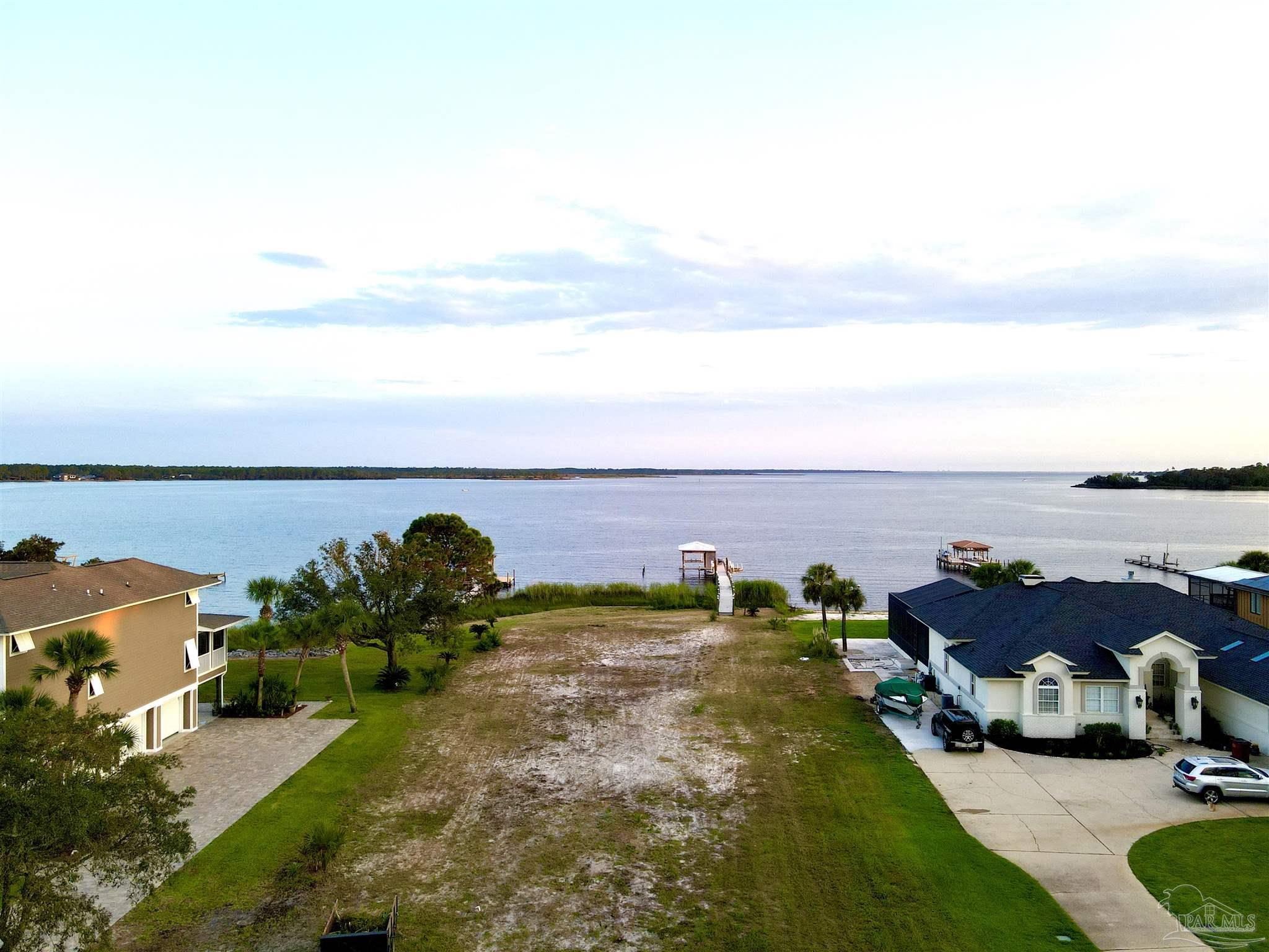 7809 Petersen Point Road Milton, FL 32583 - Photo 15 of 33 an aerial view of a houses with ocean view