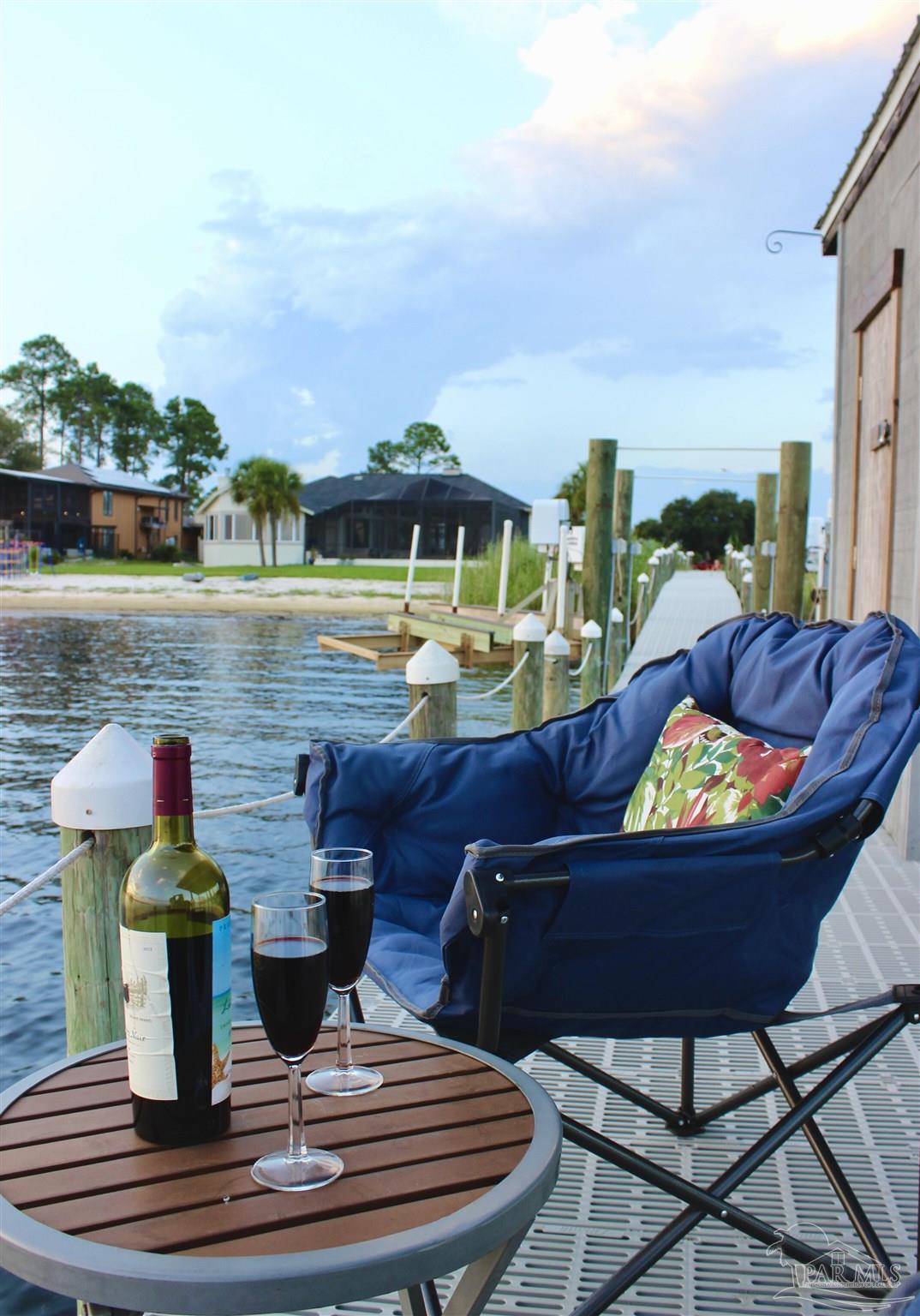 7809 Petersen Point Road Milton, FL 32583 - Photo 17 of 33 a view of a chairs and table in the terrace