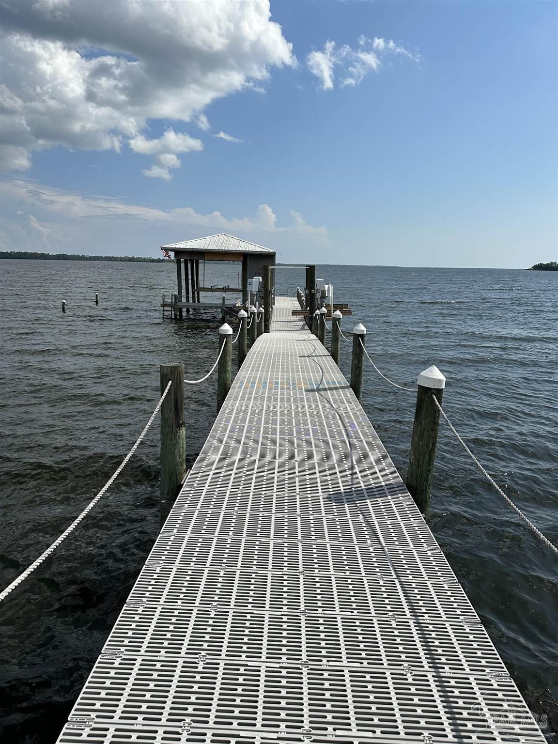 7809 Petersen Point Road Milton, FL 32583 - Photo 18 of 33 a view of a balcony with two chairs