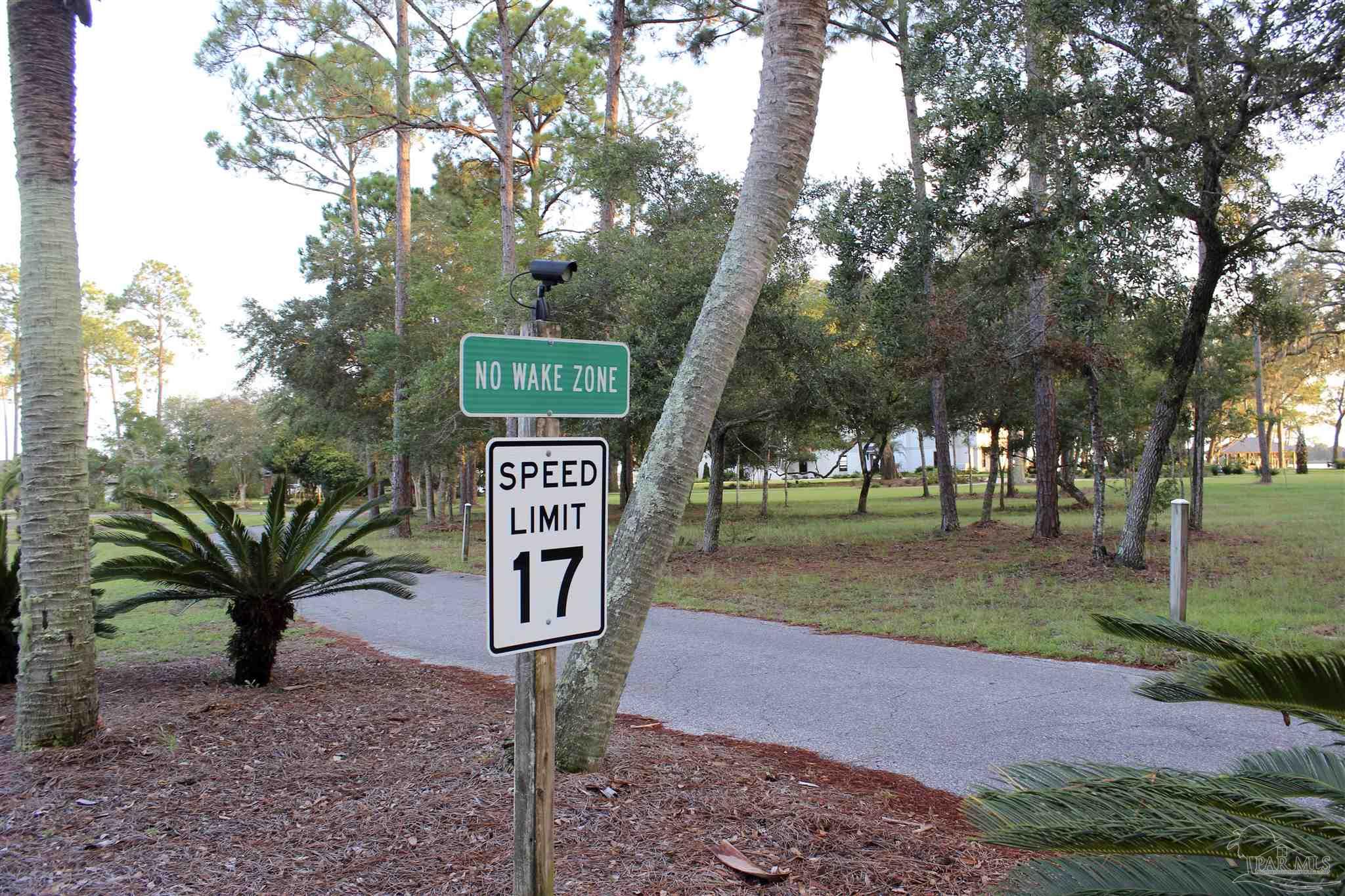 7809 Petersen Point Road Milton, FL 32583 - Photo 28 of 33 a sign board with yard in the back