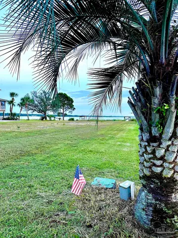 a view of a chairs and table in the yard
