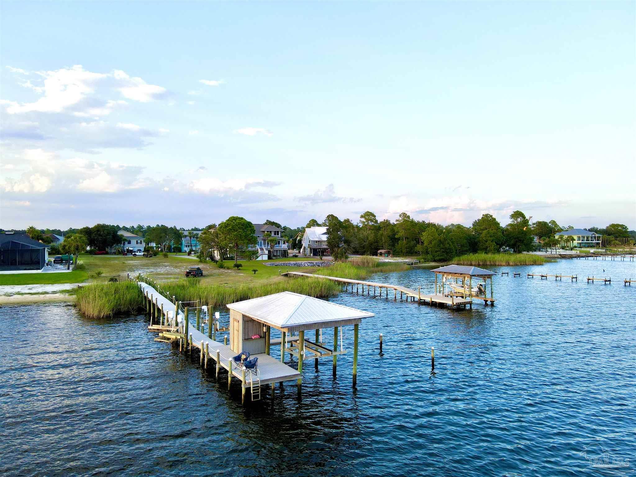 7809 Petersen Point Road Milton, FL 32583 - Photo 5 of 33 a view of swimming pool with outdoor seating yard and barbeque oven
