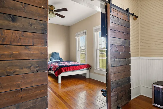 a view of a livingroom with furniture and a window