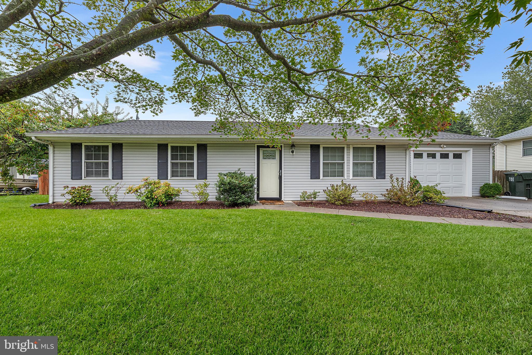 7384 Brett Road Easton, MD 21601 - Photo 1 of 29 a front view of house with a garden and patio