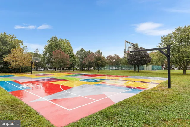 a view of a swimming pool with an outdoor space and seating area