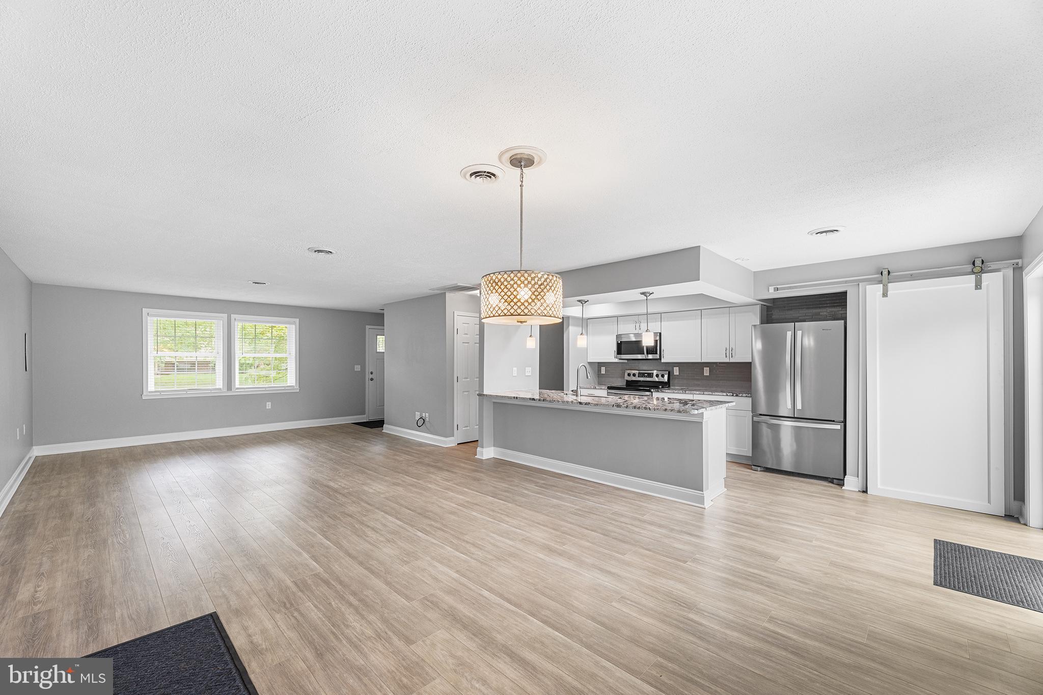 7384 Brett Road Easton, MD 21601 - Photo 6 of 29 a kitchen with a refrigerator and a sink