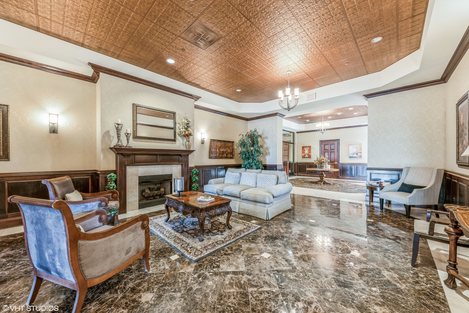 50 North Plum Grove Road, Unit 501E Palatine, IL 60067 - Photo 2 of 11 a living room with fireplace furniture and a fireplace