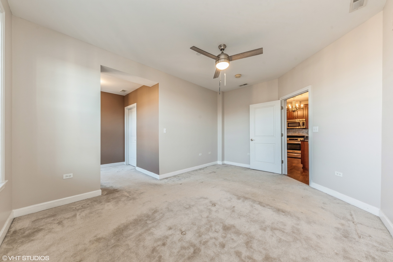 50 North Plum Grove Road, Unit 501E Palatine, IL 60067 - Photo 7 of 11 an empty room with closet and a ceiling fan