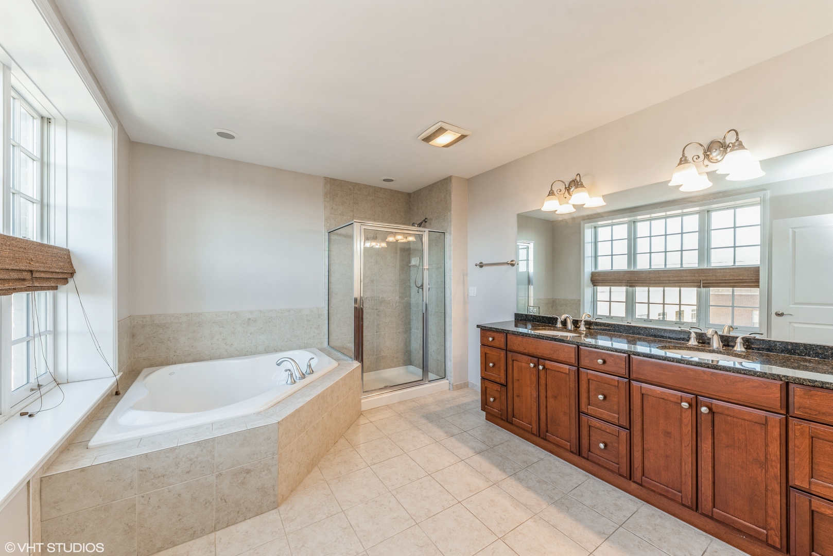 50 North Plum Grove Road, Unit 501E Palatine, IL 60067 - Photo 8 of 11 a spacious bathroom with a tub sink shower and mirror