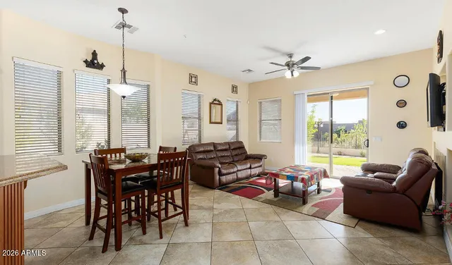 a living room with furniture windows and a chandelier