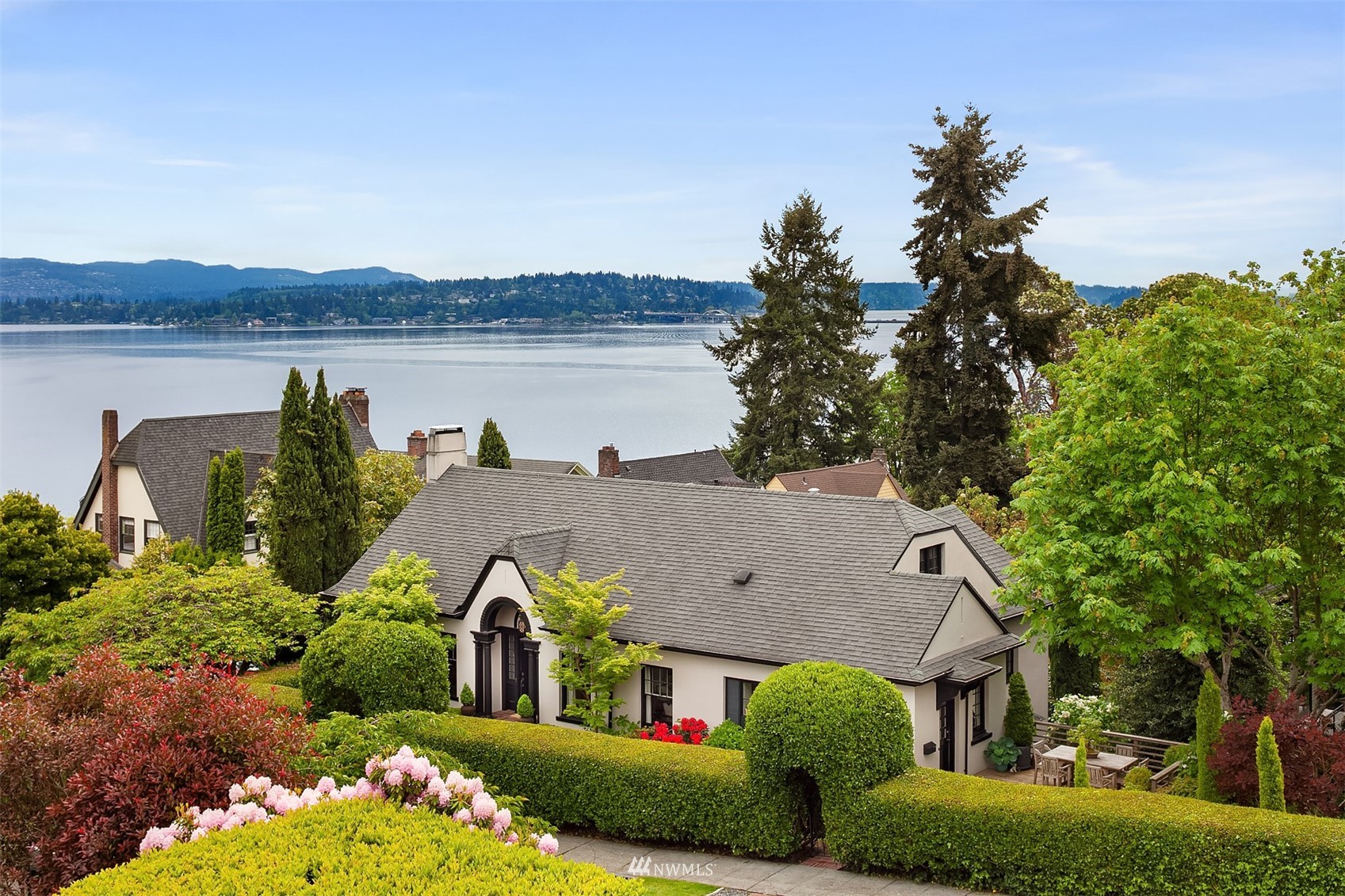 3915 East Pine Street Seattle, WA 98122 - Photo 1 of 32 a view of a house with garden and lake view