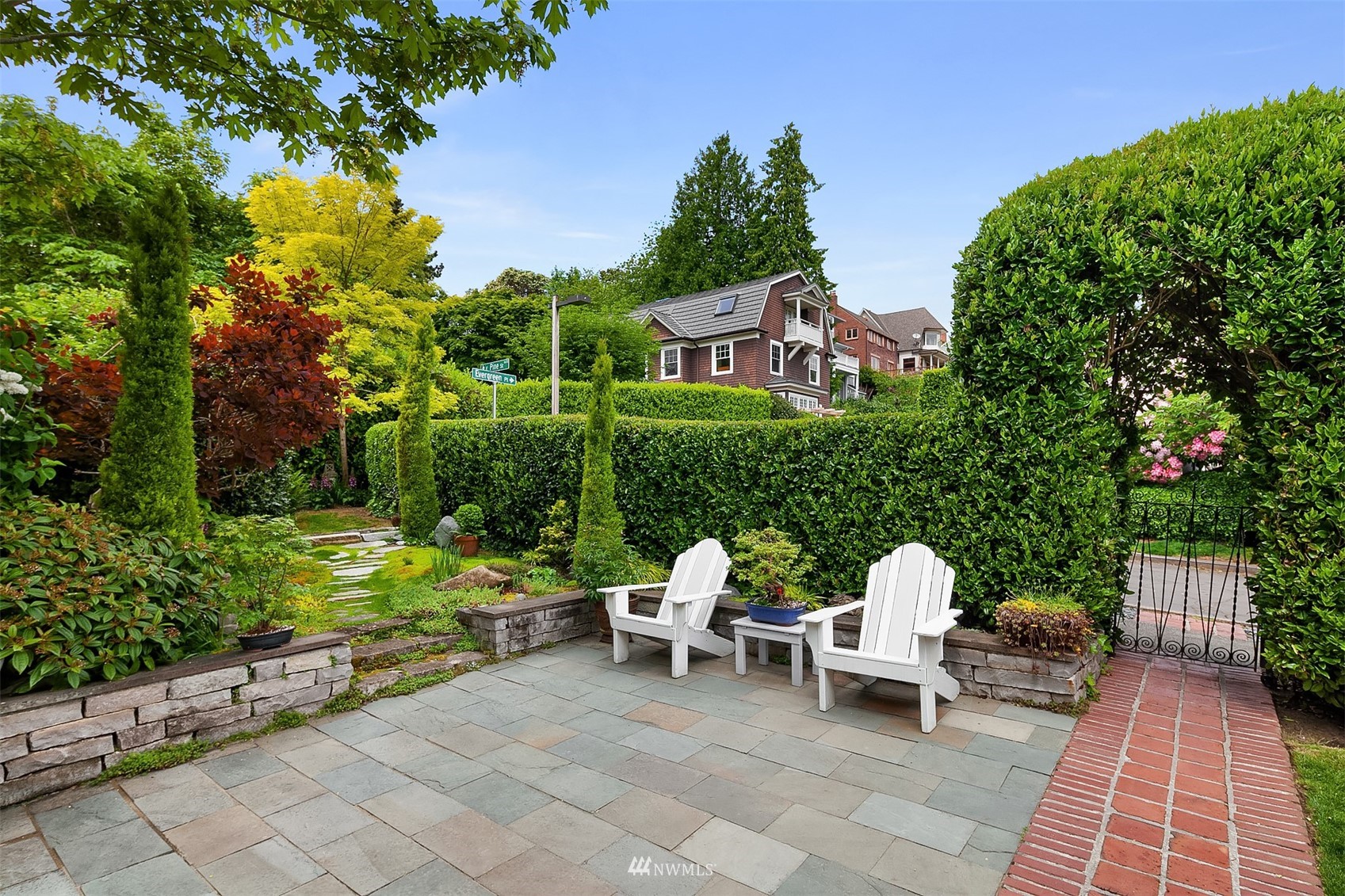 3915 East Pine Street Seattle, WA 98122 - Photo 17 of 32 a view of a chairs and table in backyard of the house