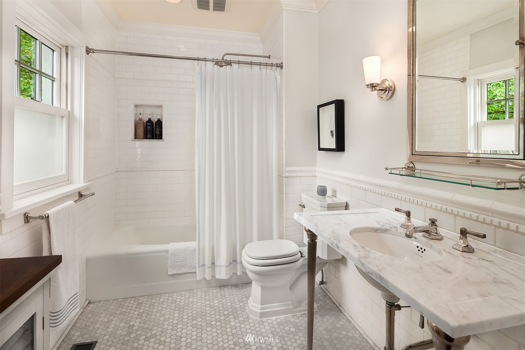 3915 East Pine Street Seattle, WA 98122 - Photo 20 of 32 a bathroom with a sink toilet and shower