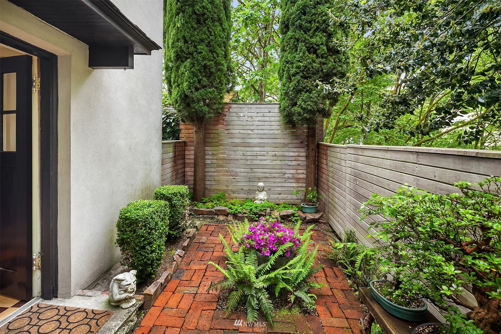 3915 East Pine Street Seattle, WA 98122 - Photo 30 of 32 a flower plants with wooden fence