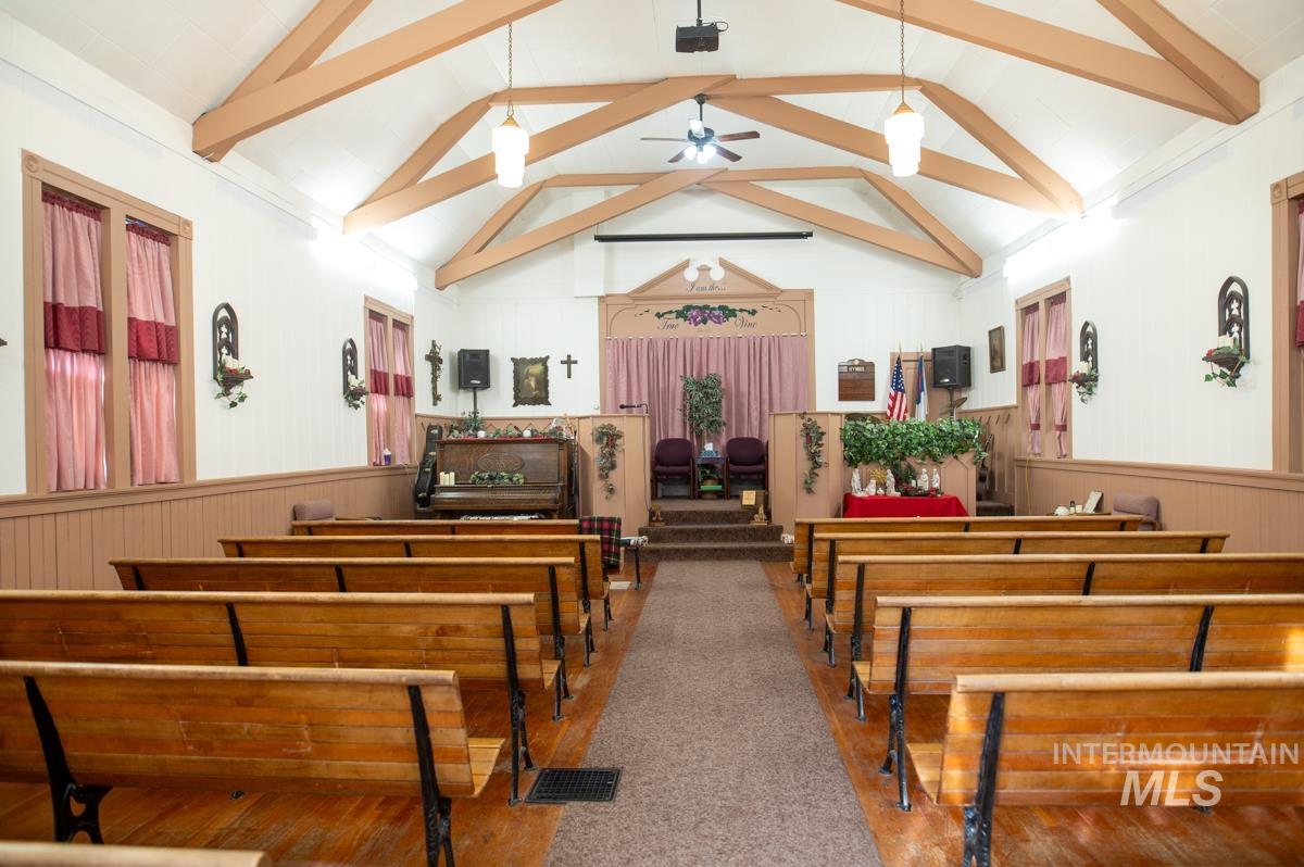 736 East Main Street Weiser, ID 83672 - Photo 16 of 17 Misc room featuring wainscoting, ceiling fan, and wooden walls