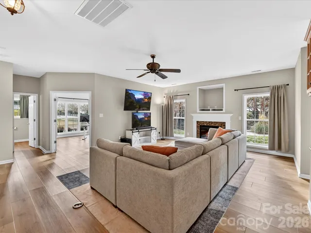 a view of workspace with wooden floor and windows