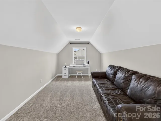 a white bath tub sitting under a bathroom