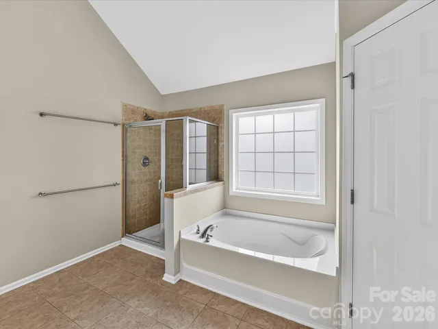 a spacious bathroom with a sink double vanity and a mirror