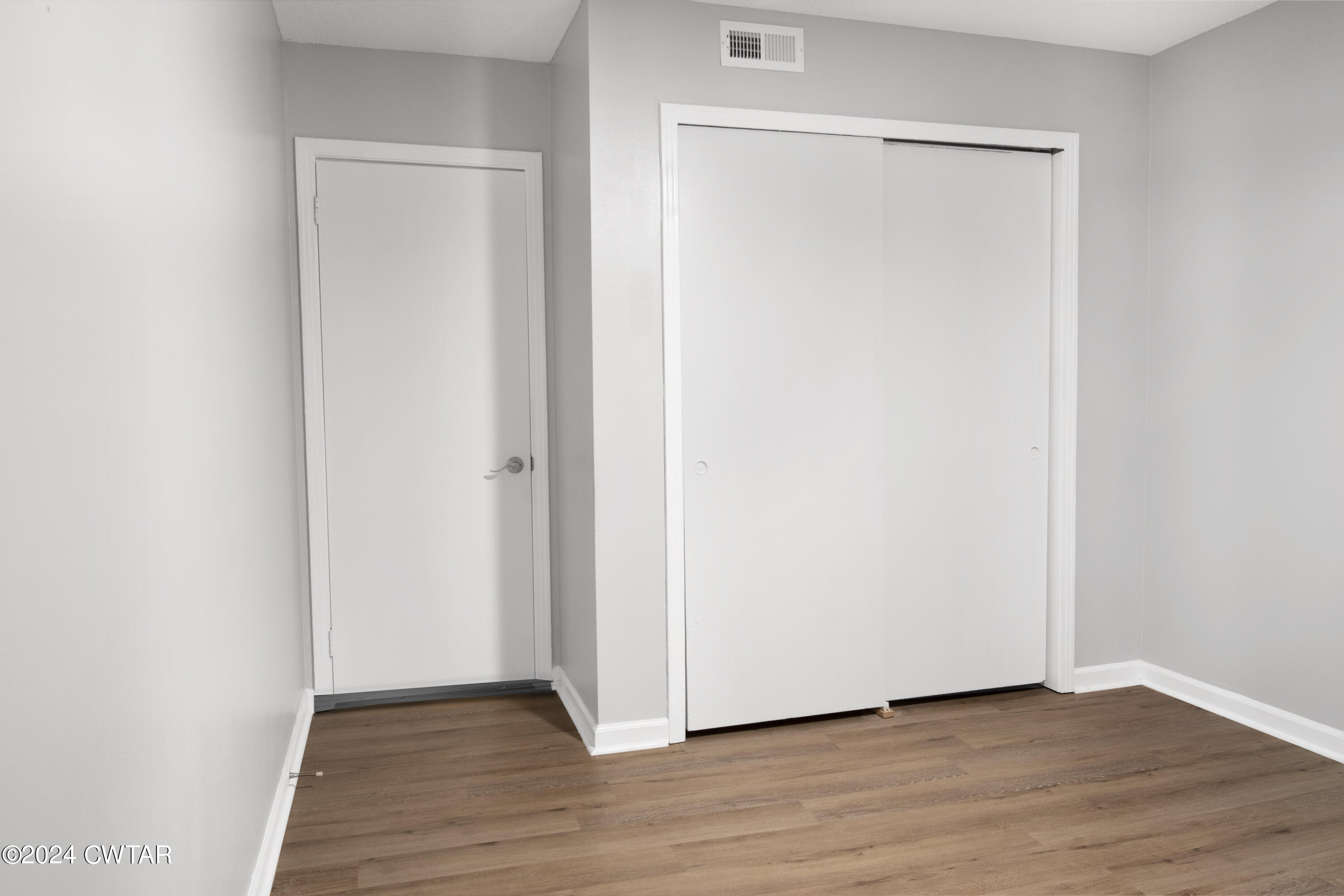 500 Paragon Mills Road Nashville, TN 37211 - Photo 11 of 14 a view of an empty room with wooden floor and closet