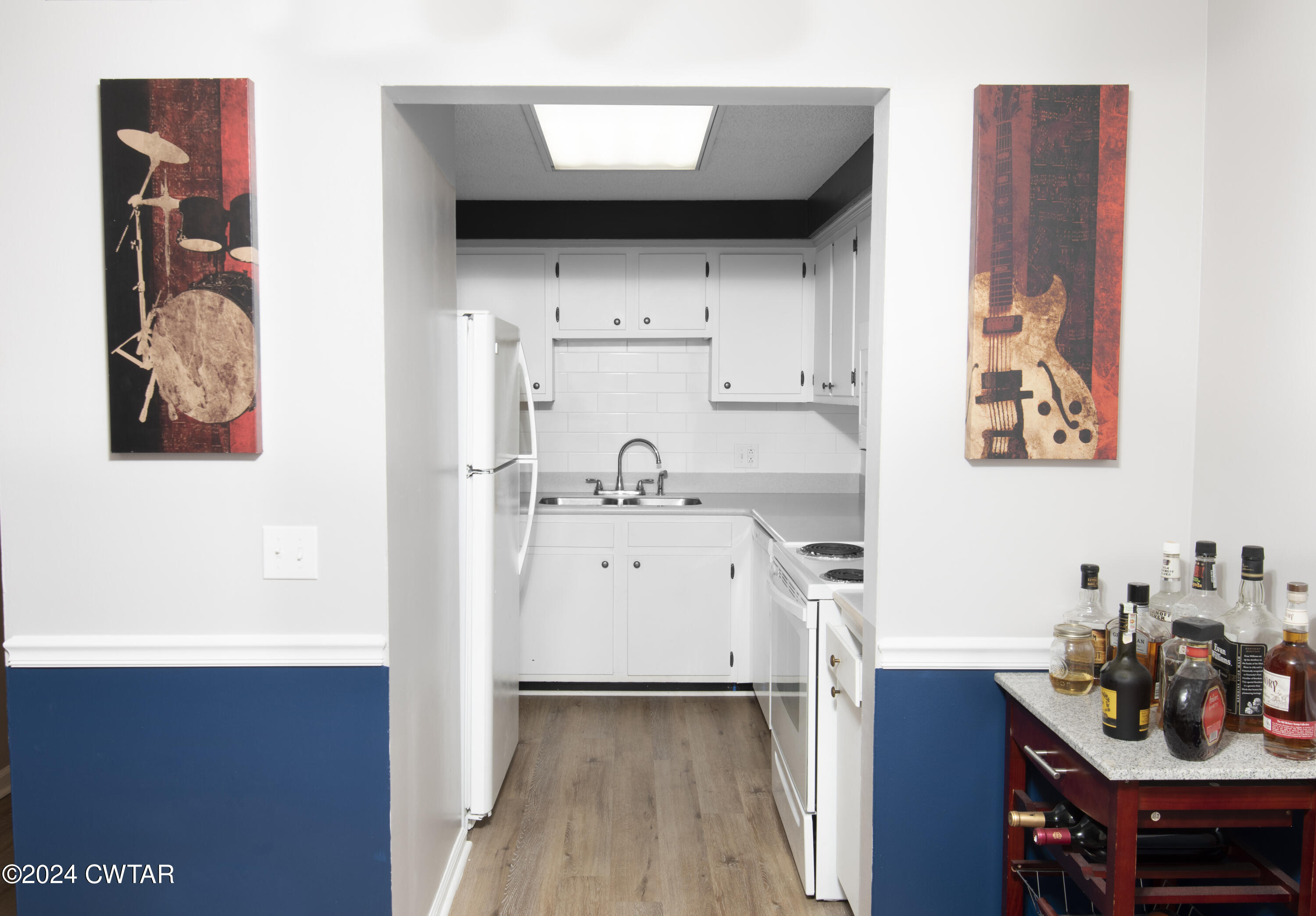 500 Paragon Mills Road Nashville, TN 37211 - Photo 5 of 14 a view of kitchen and utility room with wooden floor