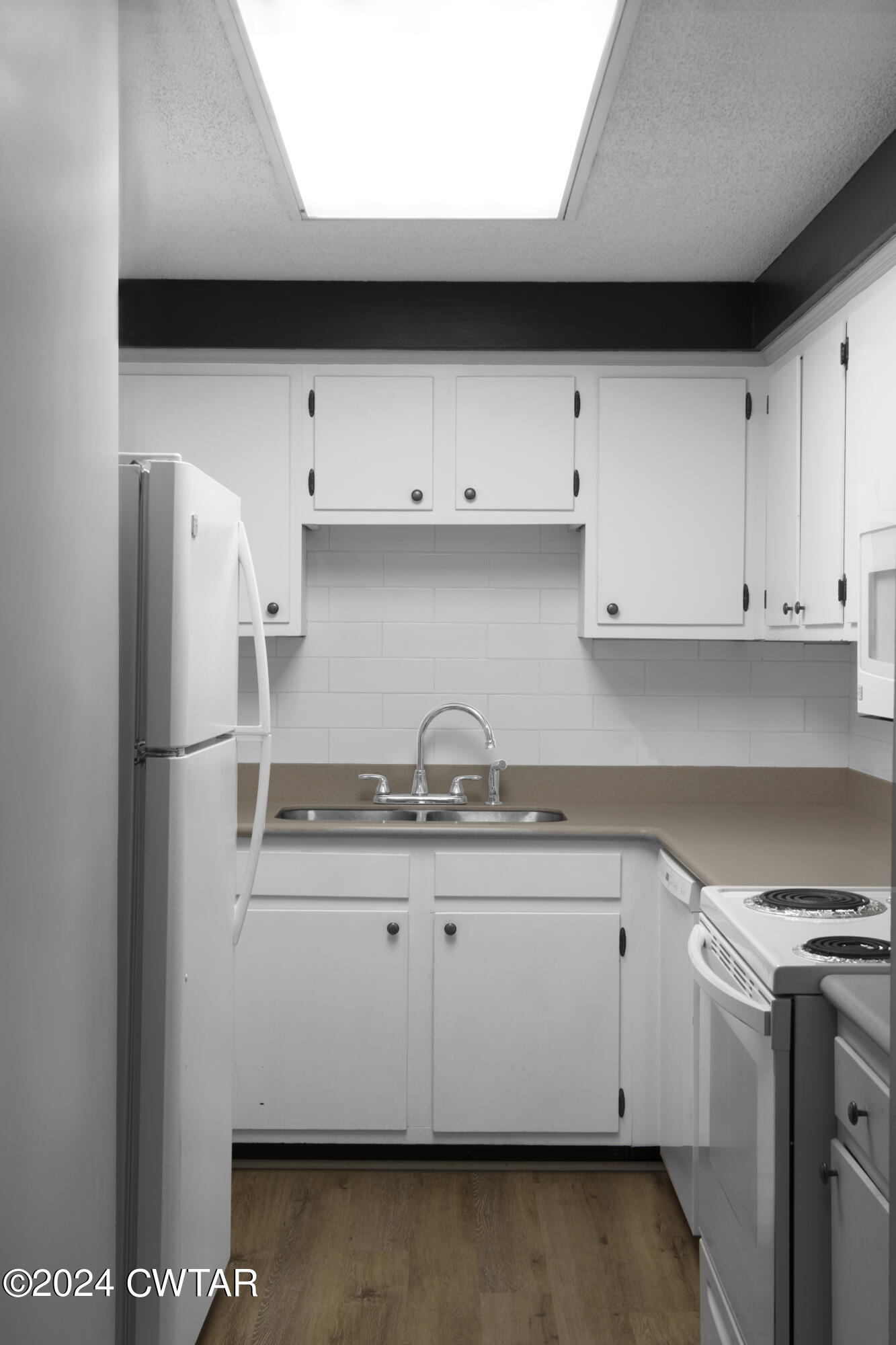 500 Paragon Mills Road Nashville, TN 37211 - Photo 6 of 14 a kitchen with stainless steel appliances granite countertop a sink a stove and a refrigerator