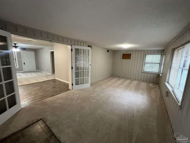 an empty room with windows