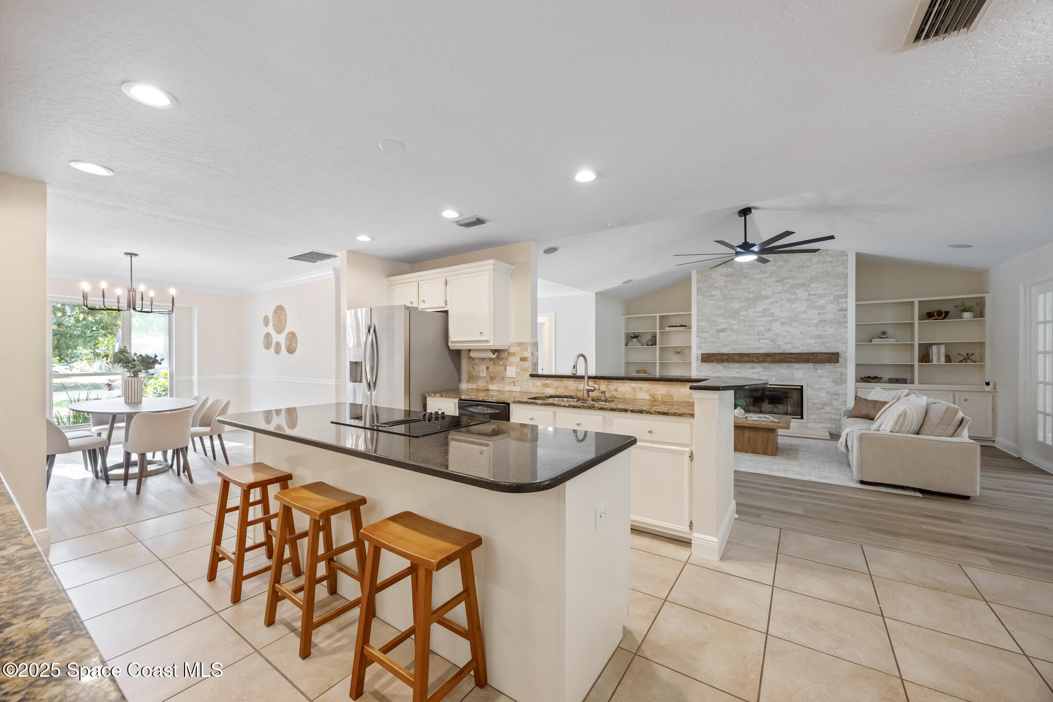 2190 Winston Drive Cocoa, FL 32926 - Photo 12 of 59 a large kitchen with granite countertop lots of counter top and dining table