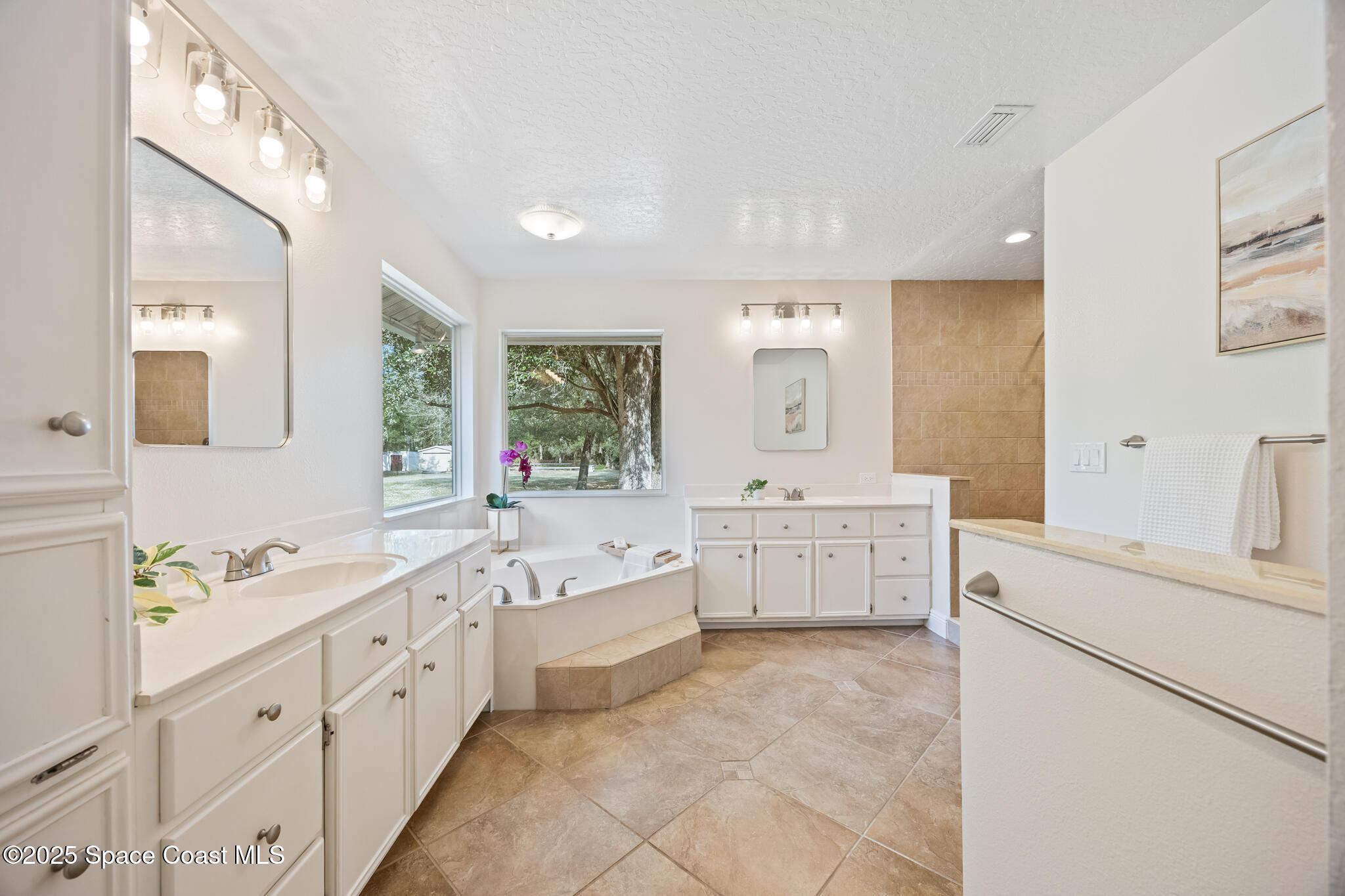 2190 Winston Drive Cocoa, FL 32926 - Photo 23 of 59 a bathroom with sink double vanity granite and a bathtub