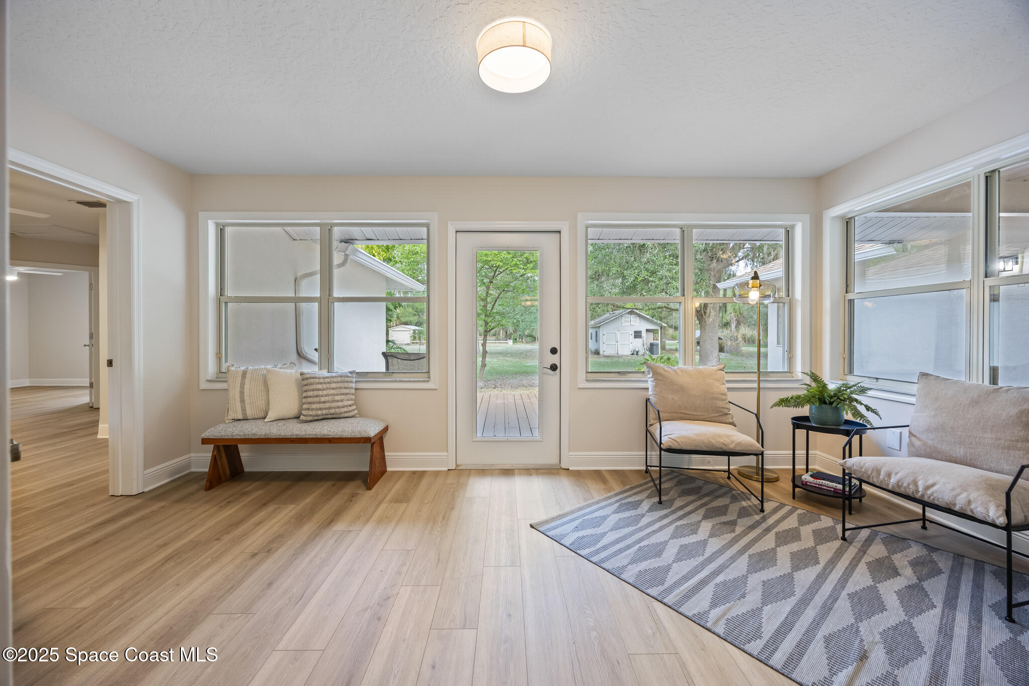 2190 Winston Drive Cocoa, FL 32926 - Photo 26 of 59 a living room with furniture and a large window