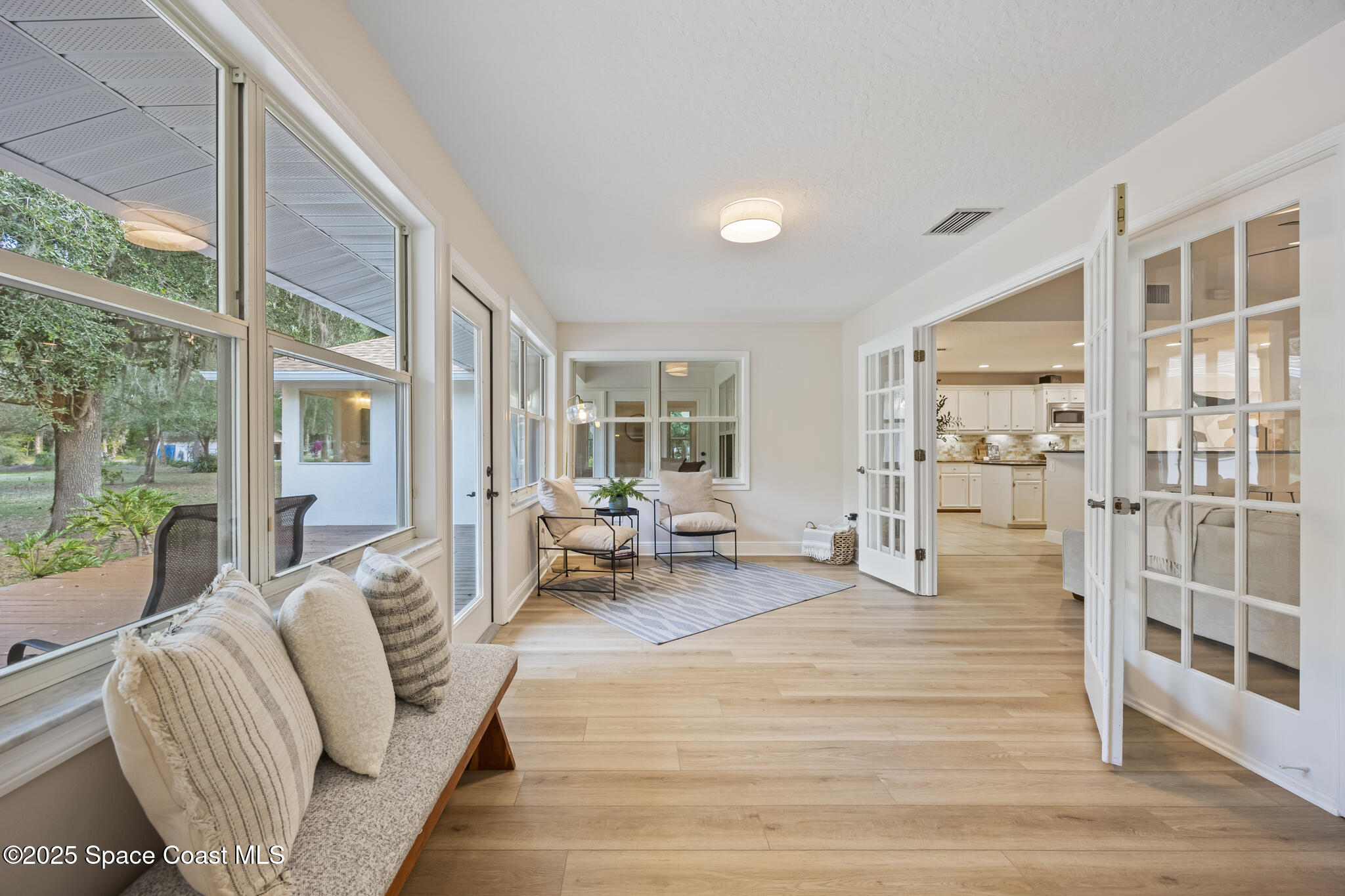 2190 Winston Drive Cocoa, FL 32926 - Photo 27 of 59 a living room with furniture and large windows