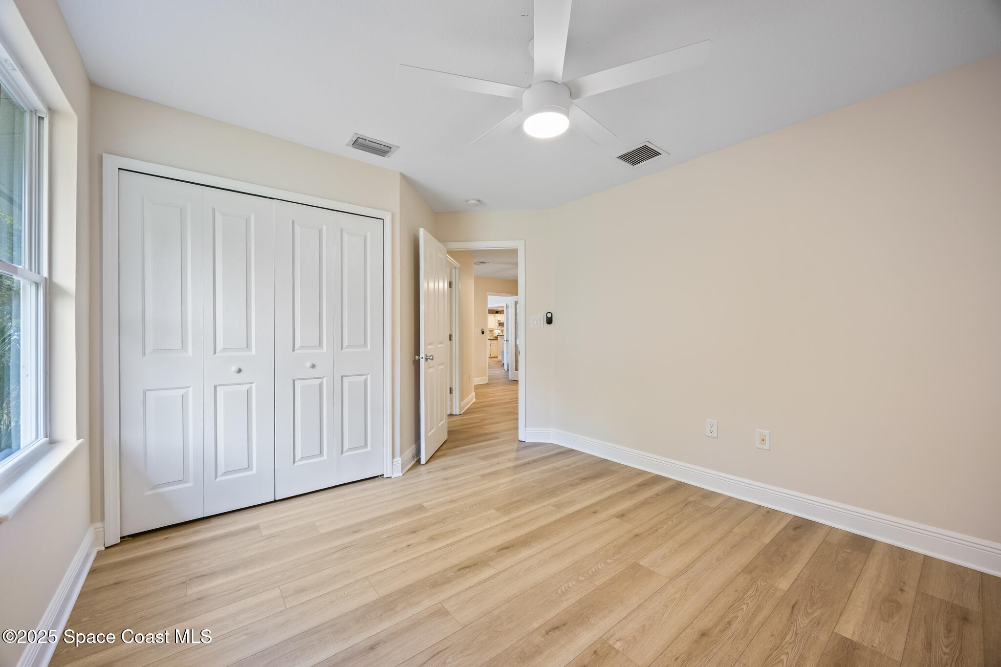 2190 Winston Drive Cocoa, FL 32926 - Photo 32 of 59 a view of an empty room with wooden floor