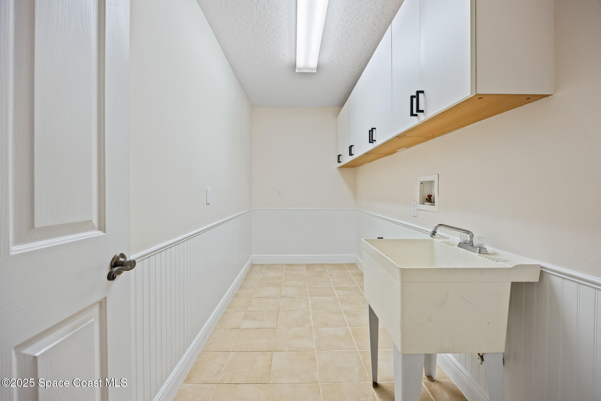 2190 Winston Drive Cocoa, FL 32926 - Photo 40 of 59 a bathroom with a sink and mirror