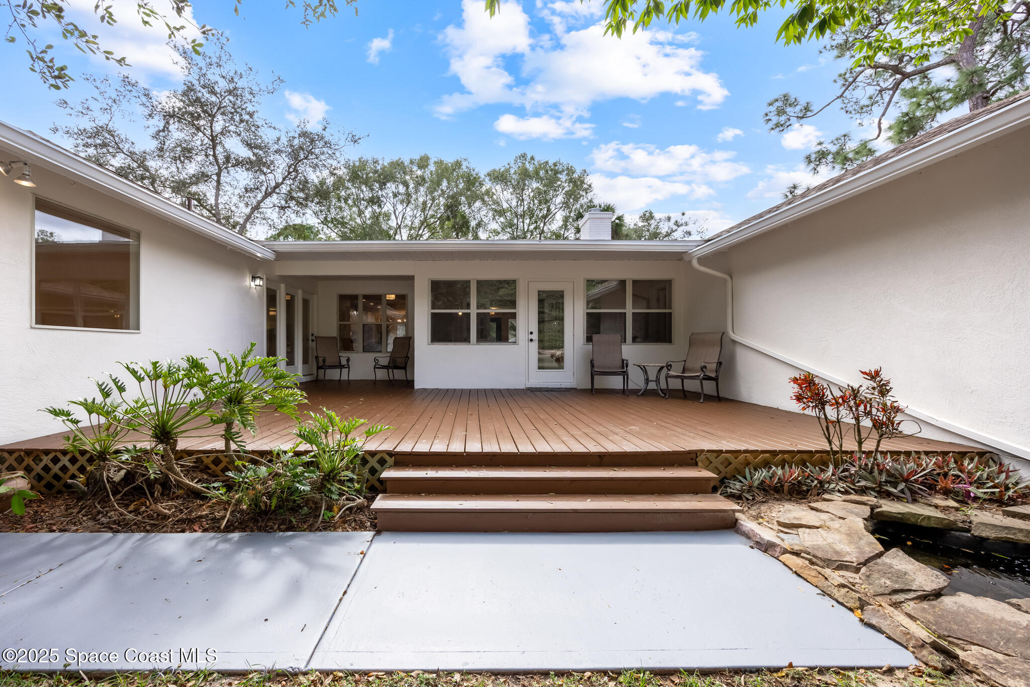 2190 Winston Drive Cocoa, FL 32926 - Photo 43 of 59 a view of a house with backyard porch and sitting area