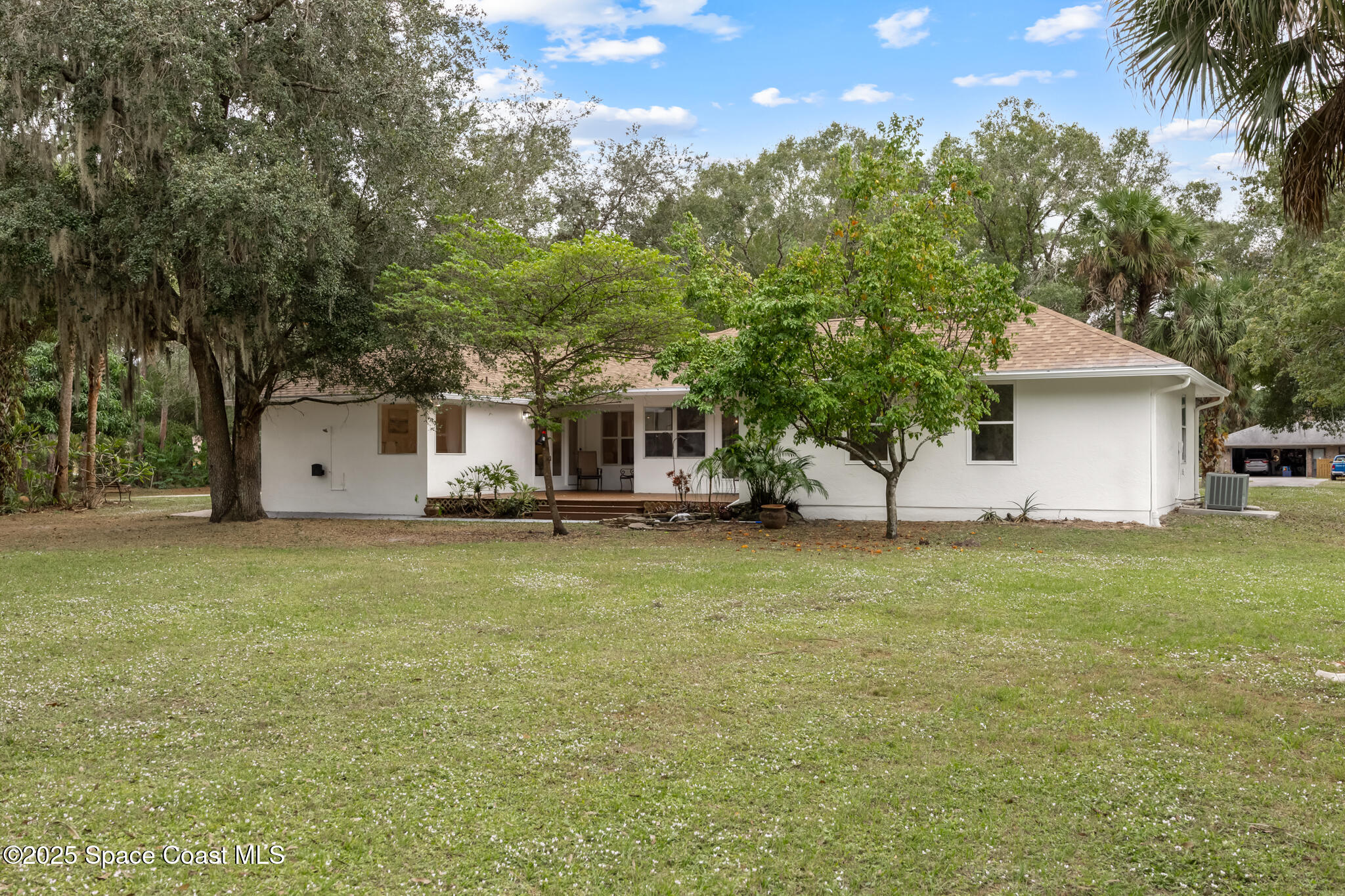 2190 Winston Drive Cocoa, FL 32926 - Photo 50 of 59 a front view of a house with a garden