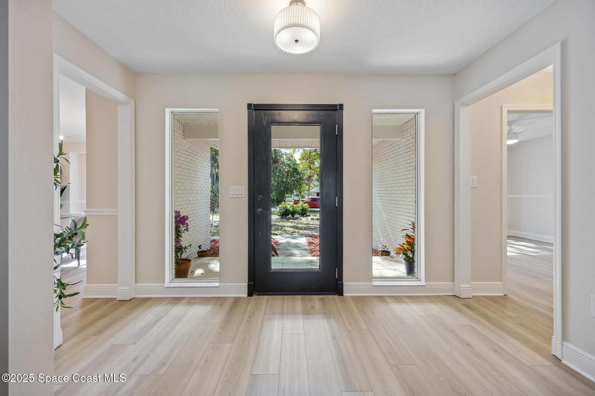 2190 Winston Drive Cocoa, FL 32926 - Photo 5 of 59 wooden floor in an empty room with a window