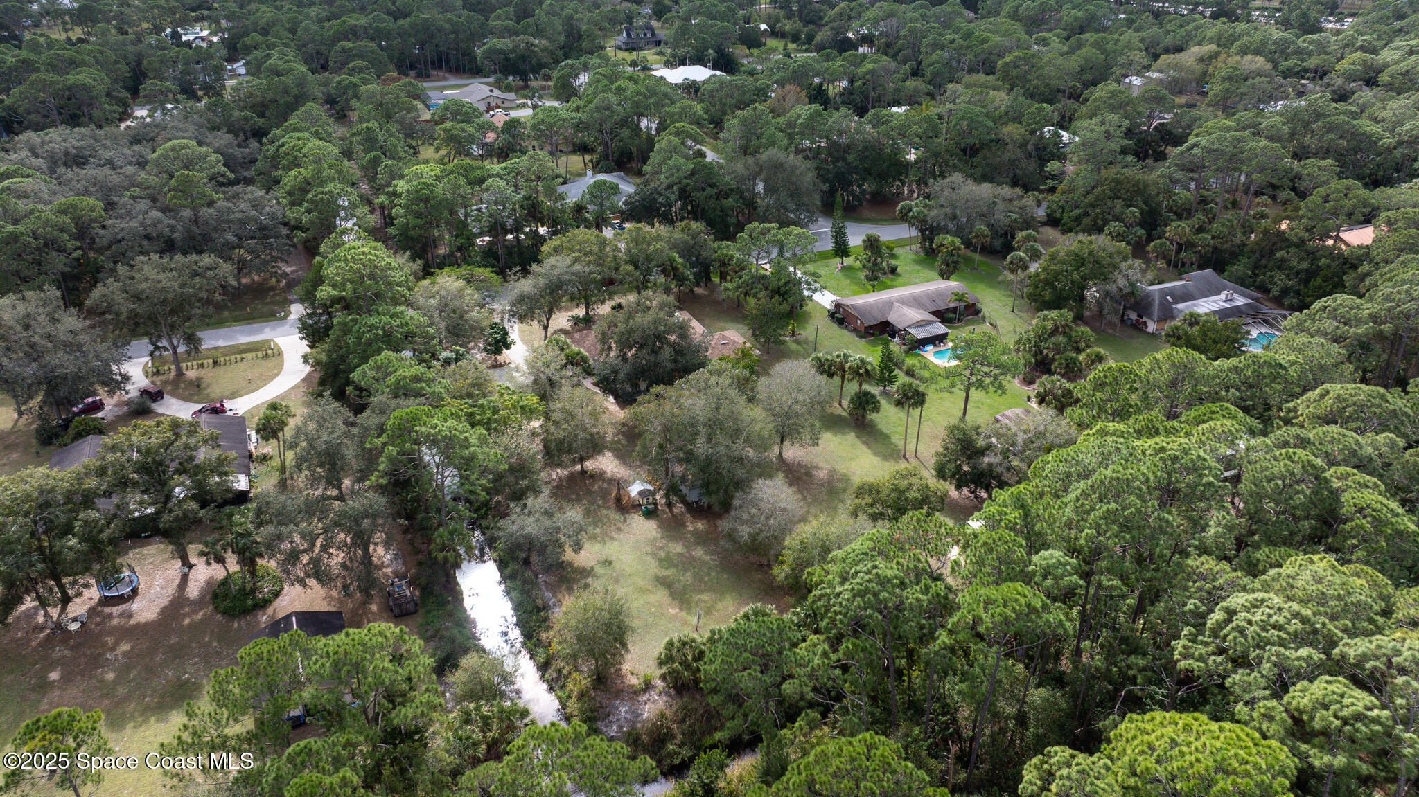 2190 Winston Drive Cocoa, FL 32926 - Photo 58 of 59 an aerial view of a house with a yard