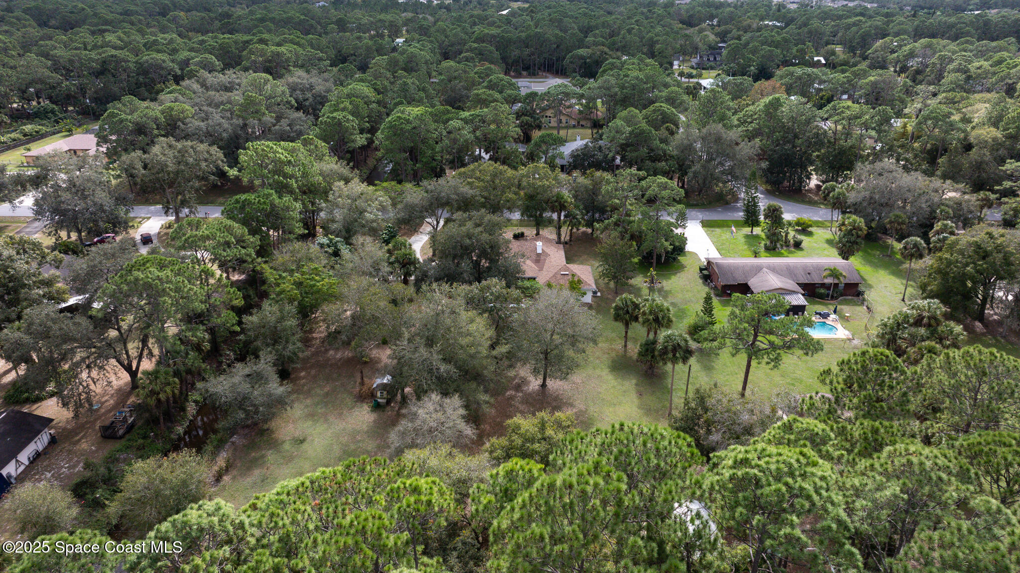 2190 Winston Drive Cocoa, FL 32926 - Photo 59 of 59 an aerial view of a house with a yard